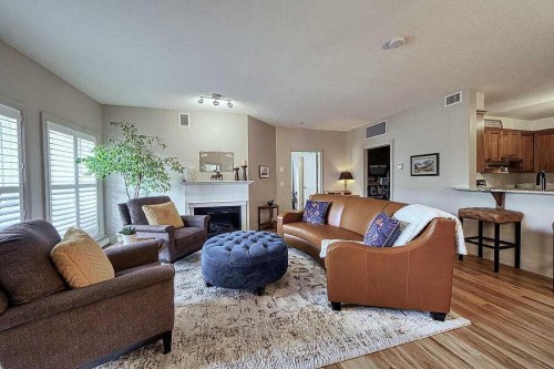 1233-151 Country Village Road Ne, Calgary, AB - Indoor Photo Showing Living Room With Fireplace