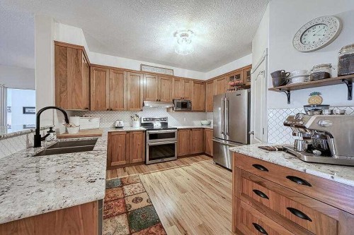1233-151 Country Village Road Ne, Calgary, AB - Indoor Photo Showing Kitchen With Stainless Steel Kitchen With Double Sink