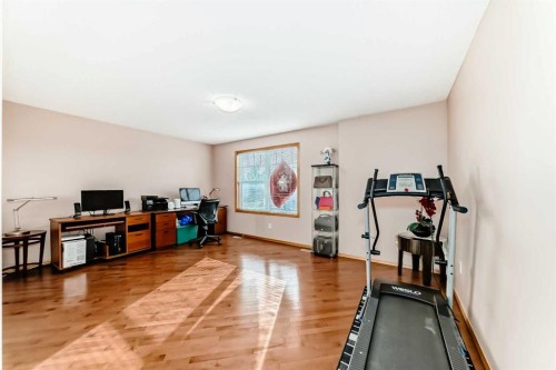 16062 Everstone Road Sw, Calgary, AB - Indoor Photo Showing Gym Room