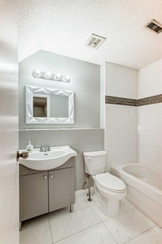 1201 53B Street Se, Calgary, AB - Indoor Photo Showing Bathroom