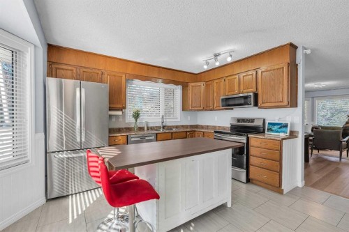 1318 Whitfield Avenue, Crossfield, AB - Indoor Photo Showing Kitchen With Double Sink