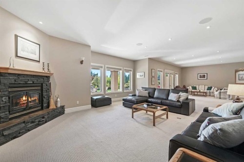 1 Pinehurst Drive, Heritage Pointe, AB - Indoor Photo Showing Living Room With Fireplace
