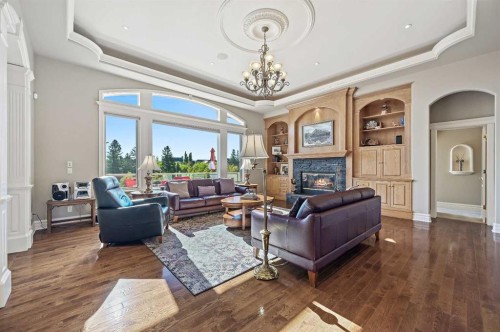1 Pinehurst Drive, Heritage Pointe, AB - Indoor Photo Showing Living Room With Fireplace