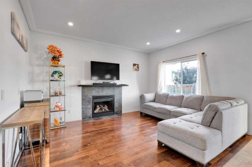 175 Evansmeade Common Nw, Calgary, AB - Indoor Photo Showing Living Room With Fireplace