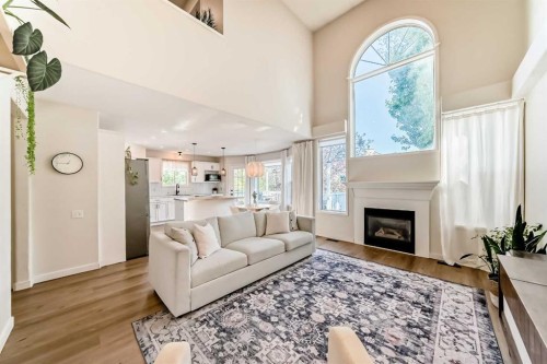 132 Hidden Valley Crescent Nw, Calgary, AB - Indoor Photo Showing Living Room With Fireplace