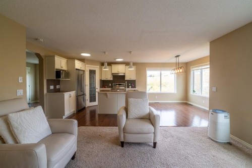 150 Tuscany Summit Heath Nw, Calgary, AB - Indoor Photo Showing Living Room