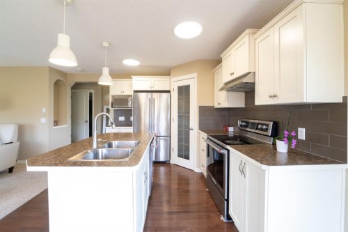 150 Tuscany Summit Heath Nw, Calgary, AB - Indoor Photo Showing Kitchen With Stainless Steel Kitchen With Double Sink With Upgraded Kitchen