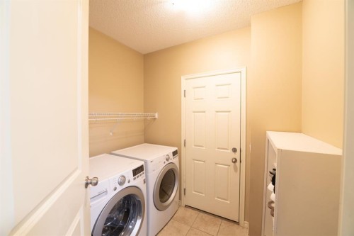 150 Tuscany Summit Heath Nw, Calgary, AB - Indoor Photo Showing Laundry Room
