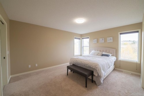 150 Tuscany Summit Heath Nw, Calgary, AB - Indoor Photo Showing Bedroom