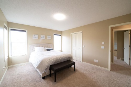 150 Tuscany Summit Heath Nw, Calgary, AB - Indoor Photo Showing Bedroom