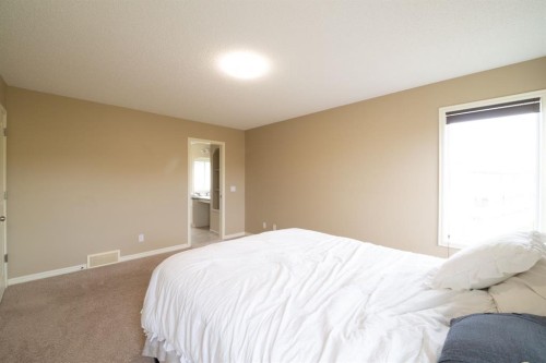 150 Tuscany Summit Heath Nw, Calgary, AB - Indoor Photo Showing Bedroom