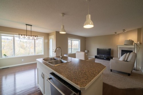 150 Tuscany Summit Heath Nw, Calgary, AB - Indoor Photo Showing Other Room With Fireplace