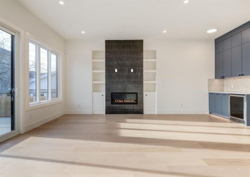 507 26 Avenue Ne, Calgary, AB - Indoor Photo Showing Other Room With Fireplace