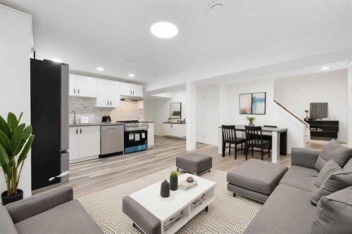 28 Henefer Road Sw, Calgary, AB - Indoor Photo Showing Living Room