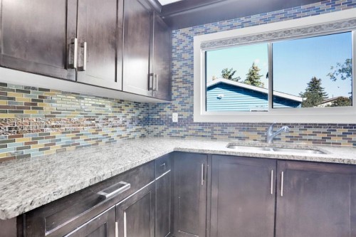 120 Tararidge Close Ne, Calgary, AB - Indoor Photo Showing Kitchen With Double Sink