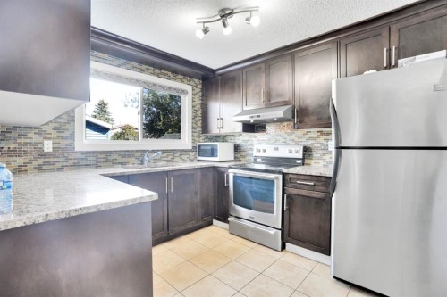 120 Tararidge Close Ne, Calgary, AB - Indoor Photo Showing Kitchen