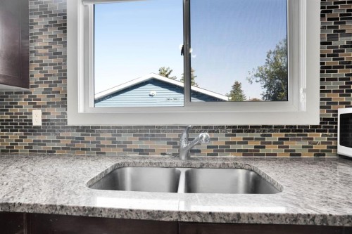 120 Tararidge Close Ne, Calgary, AB - Indoor Photo Showing Kitchen With Double Sink