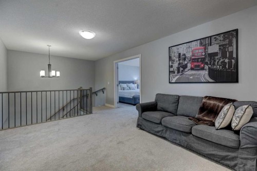 878 Bluerock Way Sw, Calgary, AB - Indoor Photo Showing Living Room