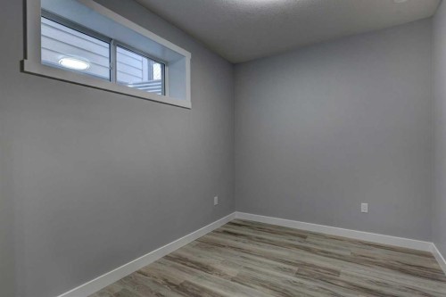 878 Bluerock Way Sw, Calgary, AB - Indoor Photo Showing Other Room