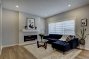 878 Bluerock Way Sw, Calgary, AB  - Indoor Photo Showing Living Room With Fireplace 
