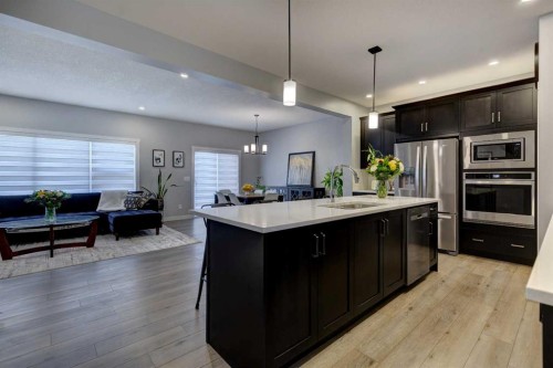 878 Bluerock Way Sw, Calgary, AB - Indoor Photo Showing Kitchen With Upgraded Kitchen