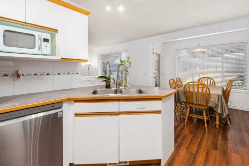 85 Bridlewood Street Sw, Calgary, AB - Indoor Photo Showing Kitchen With Double Sink