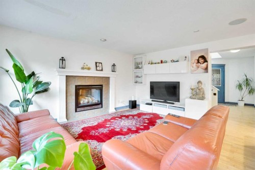 204 Covehaven Gardens Ne, Calgary, AB - Indoor Photo Showing Living Room With Fireplace