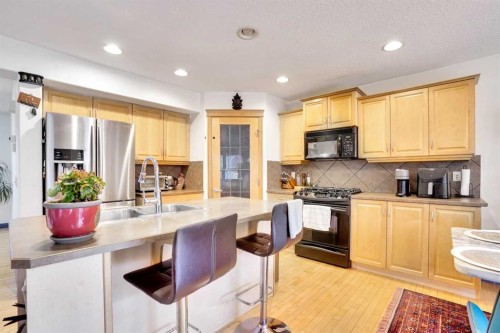 204 Covehaven Gardens Ne, Calgary, AB - Indoor Photo Showing Kitchen With Double Sink