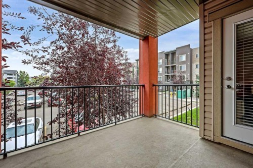 2212-403 Mackenzie Way Sw, Airdrie, AB - Outdoor With Balcony With Exterior
