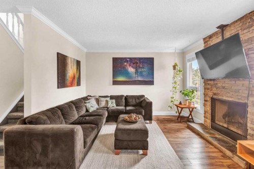 4532 Montgomery Avenue Nw, Calgary, AB - Indoor Photo Showing Living Room With Fireplace