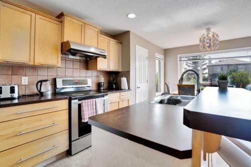 228 Covehaven Terrace Ne, Calgary, AB - Indoor Photo Showing Kitchen With Double Sink