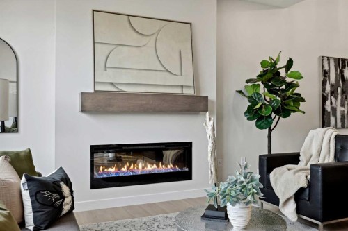 43 Versant View Sw, Calgary, AB - Indoor Photo Showing Living Room With Fireplace
