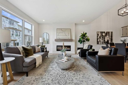 43 Versant View Sw, Calgary, AB - Indoor Photo Showing Living Room With Fireplace