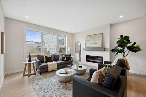 43 Versant View Sw, Calgary, AB - Indoor Photo Showing Living Room With Fireplace