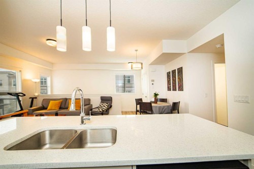 120 Spring Creek Common Sw, Calgary, AB - Indoor Photo Showing Kitchen With Double Sink