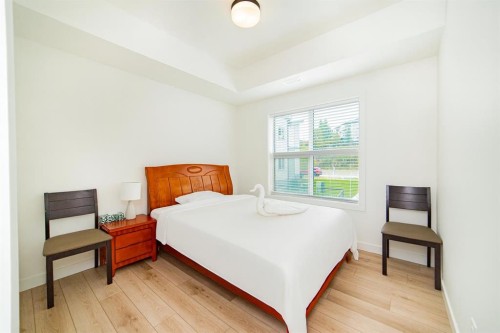 120 Spring Creek Common Sw, Calgary, AB - Indoor Photo Showing Bedroom