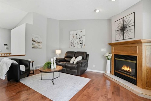 12 Bow Way, Cochrane, AB - Indoor Photo Showing Living Room With Fireplace