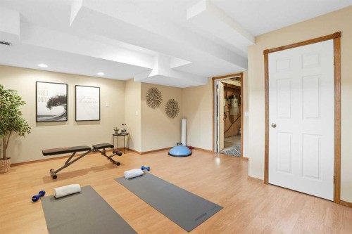 12 Bow Way, Cochrane, AB - Indoor Photo Showing Gym Room