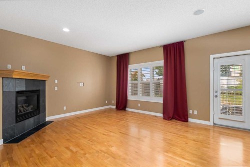 78 New Brighton Manor Se, Calgary, AB - Indoor Photo Showing Other Room With Fireplace