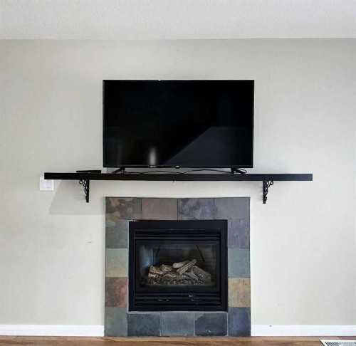4155 15 Avenue, Edson, AB - Indoor Photo Showing Living Room With Fireplace
