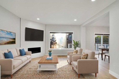 72 Panamount Manor Nw, Calgary, AB - Indoor Photo Showing Living Room With Fireplace