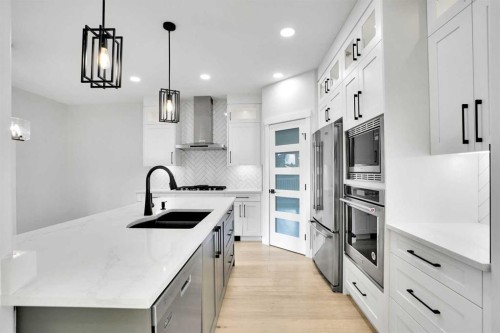 72 Panamount Manor Nw, Calgary, AB - Indoor Photo Showing Kitchen With Stainless Steel Kitchen With Double Sink With Upgraded Kitchen