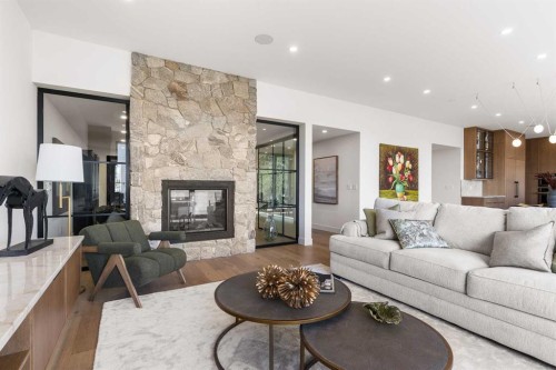 692 West Chestermere Drive, Chestermere, AB - Indoor Photo Showing Living Room With Fireplace