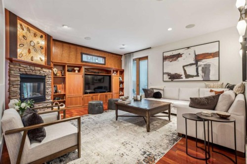 2605 4 Street Ne, Calgary, AB - Indoor Photo Showing Living Room With Fireplace