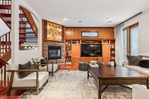 2605 4 Street Ne, Calgary, AB - Indoor Photo Showing Living Room With Fireplace