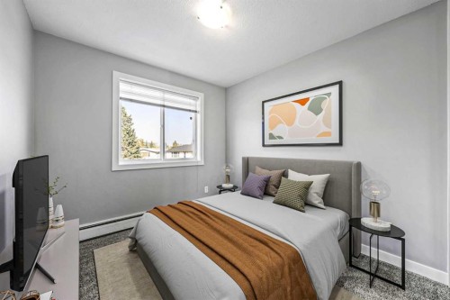 204-4455D Greenview Drive Ne, Calgary, AB - Indoor Photo Showing Bedroom