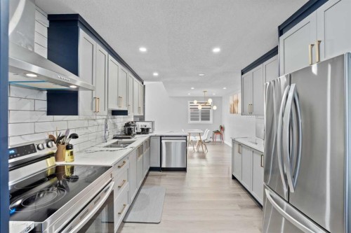 12 Cedargrove Road Sw, Calgary, AB - Indoor Photo Showing Kitchen With Double Sink With Upgraded Kitchen