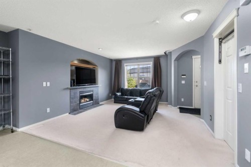 103 Saddlemont Way Ne, Calgary, AB - Indoor With Fireplace