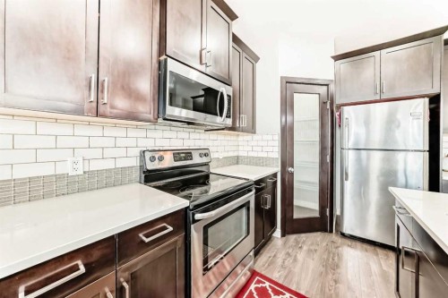 15 Evanscrest Way, Calgary, AB - Indoor Photo Showing Kitchen With Upgraded Kitchen