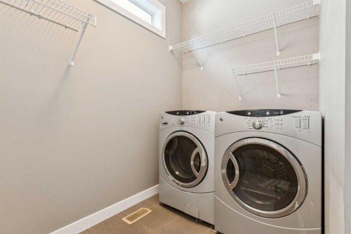 42 Chaparral Valley Place Se, Calgary, AB - Indoor Photo Showing Laundry Room
